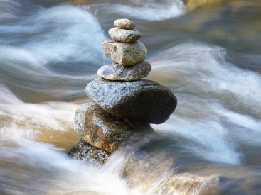 Stones surrounded by rushing water